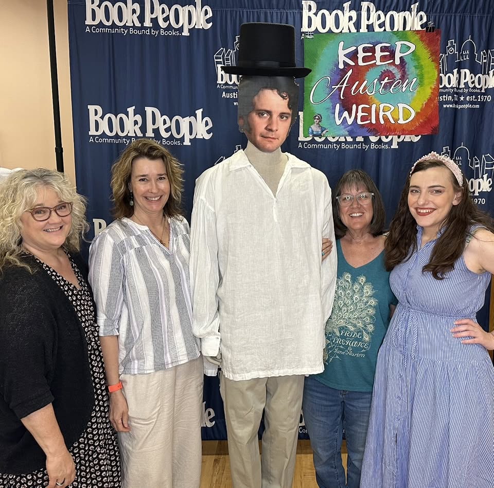 Four of our regional members pose with a Mr. Darcy cutout at an event at Bookpeople in Austin, Texas